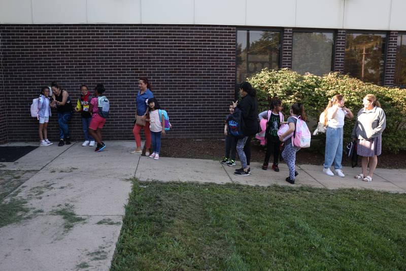 Students line up outside on the first day of school at Woodland Elementary School in Joliet. Wednesday, Aug. 17, 2022, in Joliet.