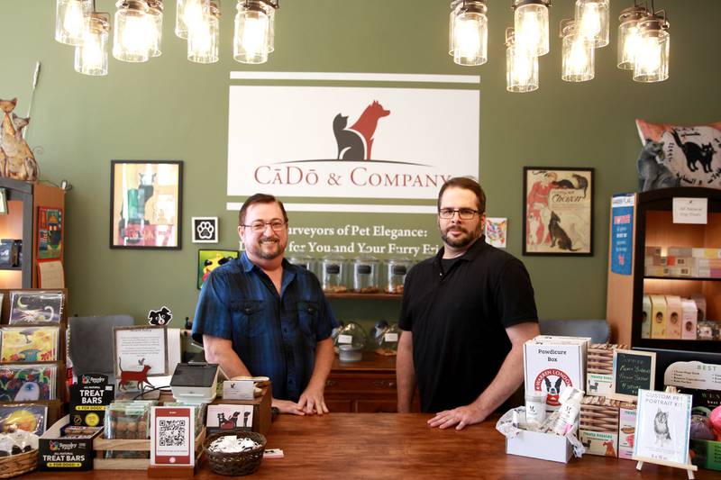 Owners Andy Wood (left) and Andy Guerrette at CaDo and Company, a pet lovers’ boutique located at 103 E. Wilson St. in downtown Batavia.