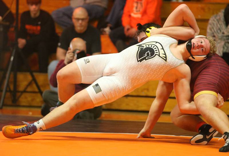 Sycamore's Collin Hughes wrestles Epeoria's Del Toro in the 285 weight class during the Class 2A Sectional championship on Saturday, Feb. 15, 2025 at Washington High School.