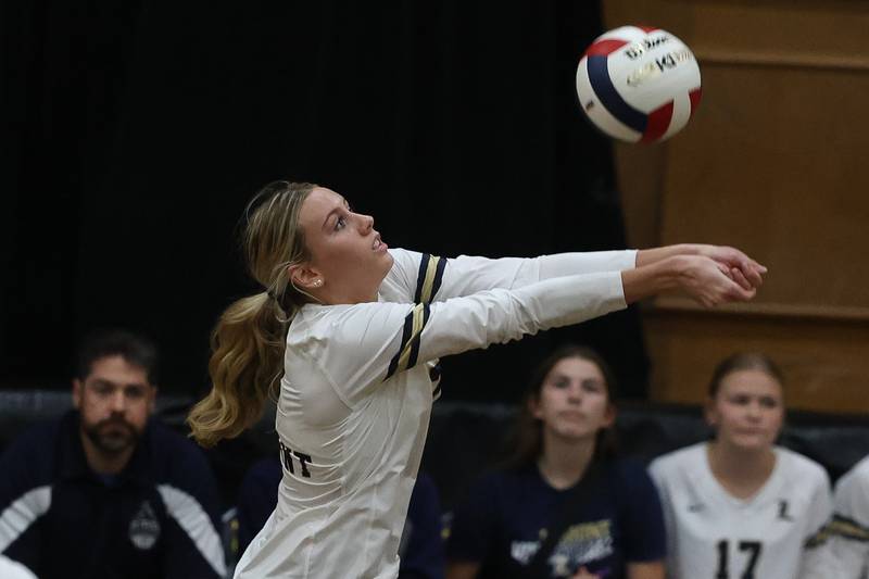 Lemont’s April Rice keeps the volley going against St. Laurence in the Class 3A St. Laurence Sectional championship on Thursday, Nov. 7, 2024 in Burbank.
