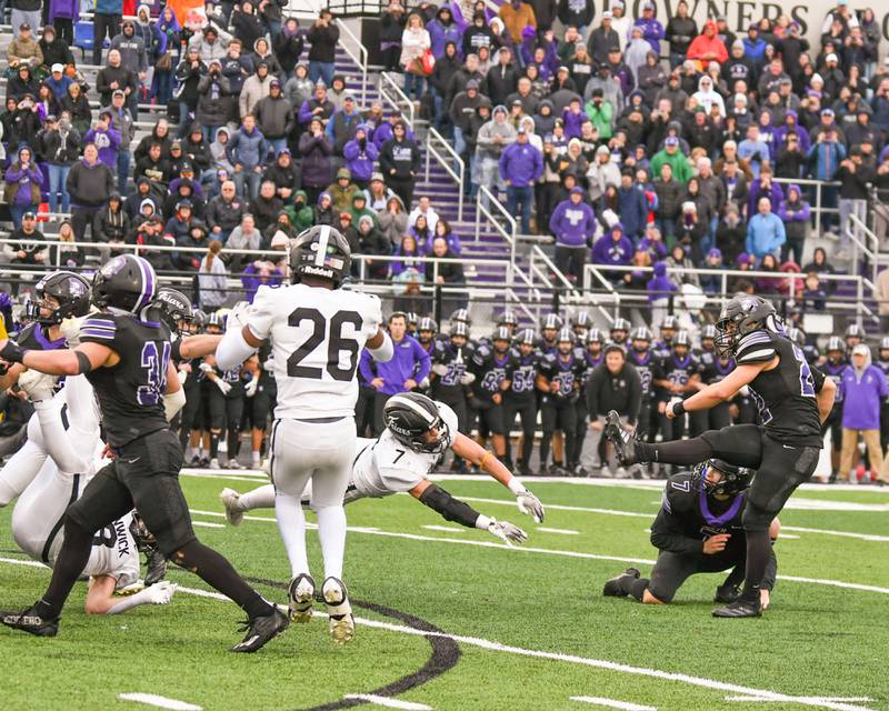 Downers Grove North's Antonio Kollintzas, right, watches his field goal attempt go up and over the uprights for a goal to win the game in the last few seconds of the game as Fenwick's Tommy Thies (7) tries to block the kick during the second week class 7A game held on Saturday Nov. 9, 2024, held at Downers Grove North High School.