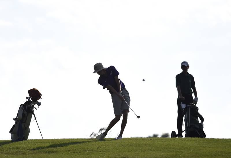 Manteno's Landon Bukowski shoots for the green at Minne Monesse Golf Club as Grant Park's Gavin Franke, right, watches on Friday, August 15, 2025.