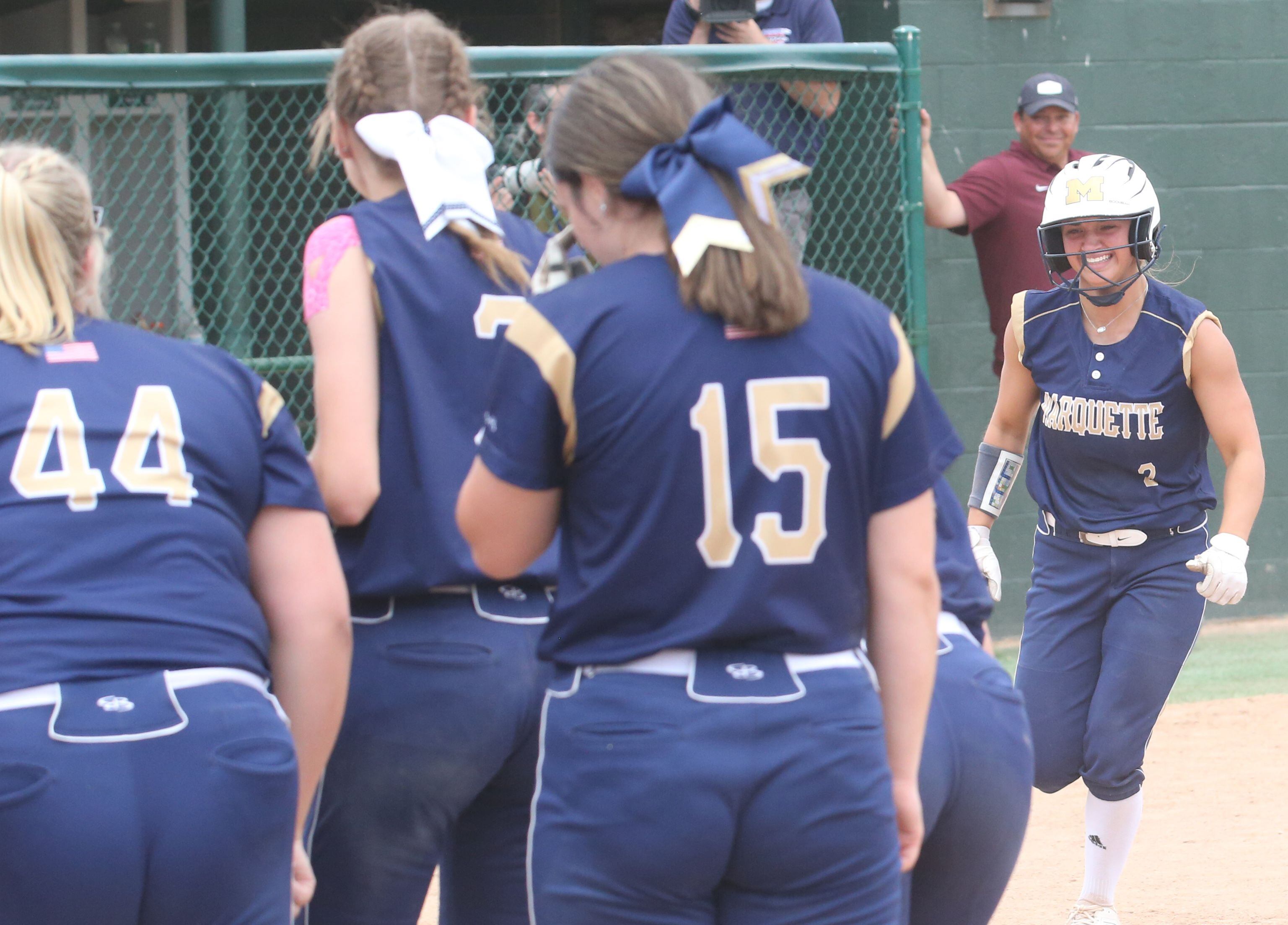 Marquette's Lindsey Kaufmann (right) smiles after hitting a home run against LeRoy during the Class 1A supersectional Monday, May 29, 2023, at Illinois Wesleyan University in Bloomington.