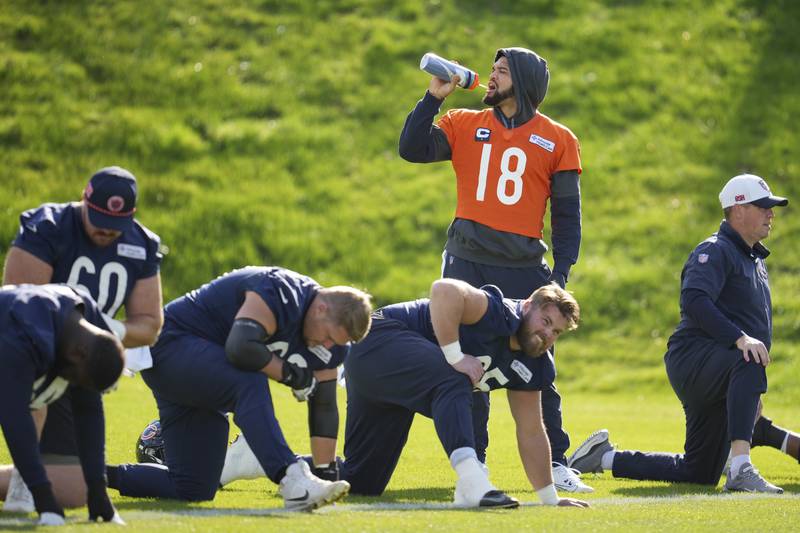 Chicago Bears quarterback Caleb Williams (18), center, participates in a NFL football training session in Ware, England, Friday, Oct. 11, 2024, ahead of the game against the Jacksonville Jaguars  at the Tottenham Hotspur stadium on Sunday. (AP Photo/Kin Cheung)