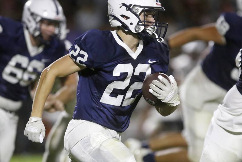 Cary-Grove's Ryan RyanLummis runs with the ball during a Fox Valley Conference football game Prairie Ridge on Friday, Aug. 29, 2025, at Cary-Grove High School in Cary.