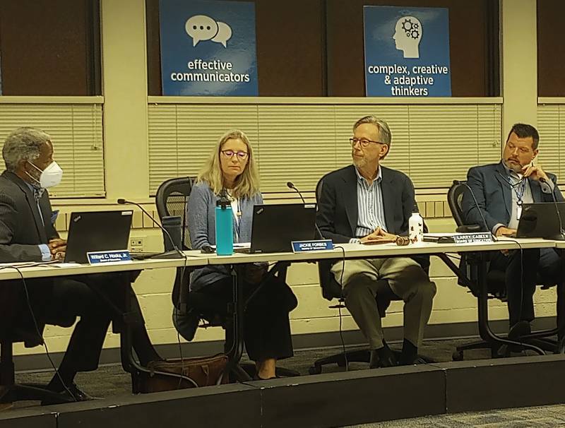 Geneva District 304 school board members Willard Hooks Jr. (left), Jackie Forbes, Board President Larry Cabeen and Superintendent Andy Barrett discuss the city’s request to support it in seeking a 12-year extension of an East Side tax increment finance district.