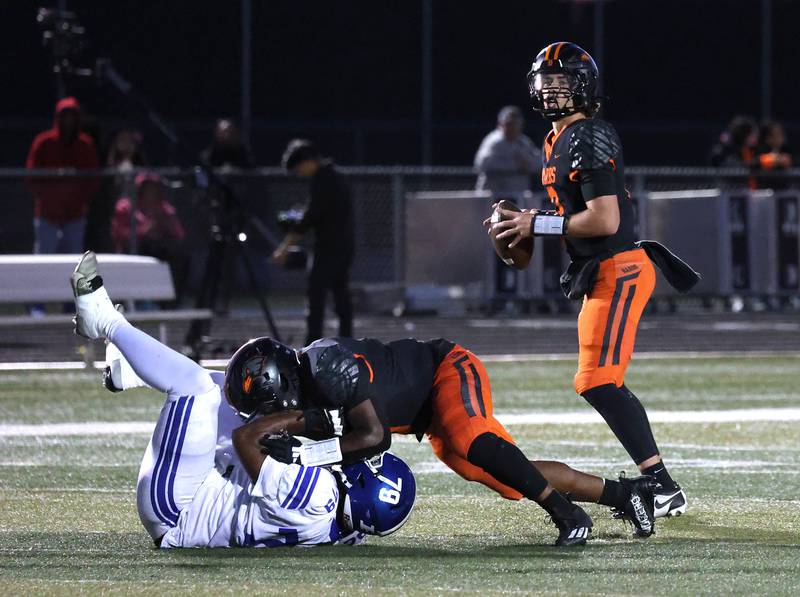 DeKalb's Cole Latimer gets good pass protection as he looks for a receiver against Phillips Friday, Sept. 5, 2025, during their game at DeKalb High School.