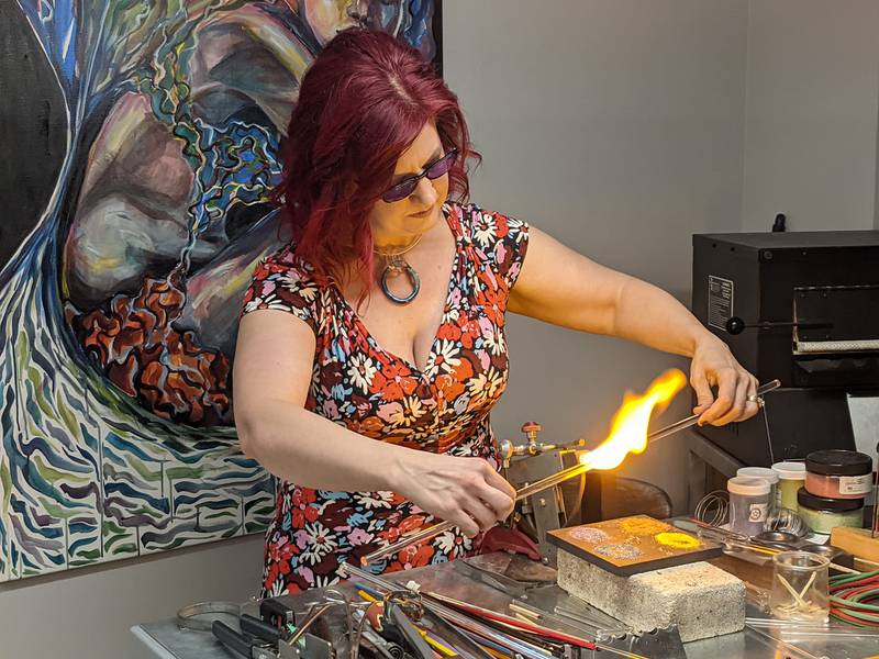 Victoria Belz demonstrated how she makes her flameworked glass art, jewelry and gifts during a grand opening held over the weekend for her new store and studio, Tinker Belz Art, located in The Berry House at 227 S. Third Street, Suite 108, in downtown Geneva.