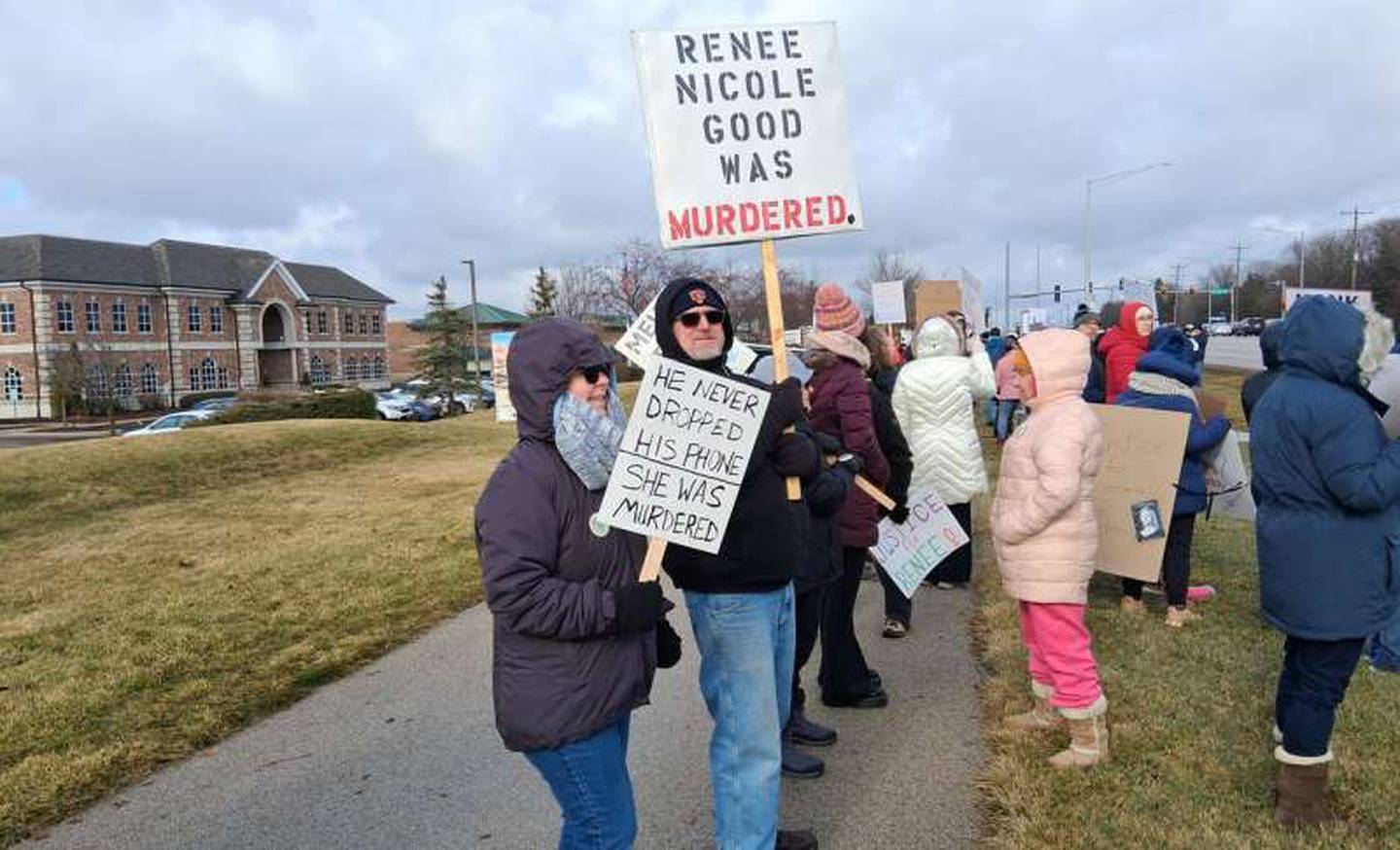 Protesters gather along Randall Road in front of the Silver Glen Crossing shopping center in South Elgin on Saturday, Jan. 10, 2026, to protest the Jan. 7, 2026, fatal shooting of Renee Good by an ICE officer in Minneapolis, Minnesota.