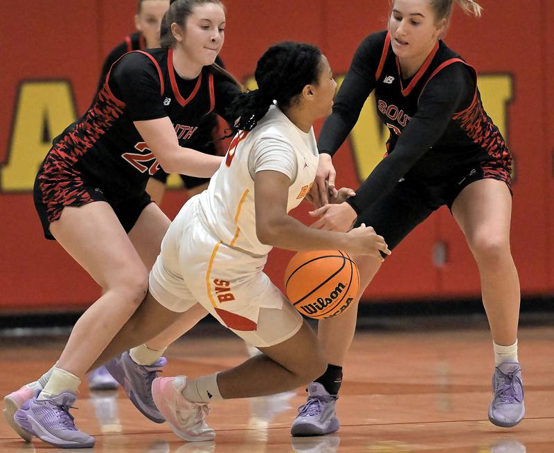 Maine South’s Ally Pape and Katie Barker, right, force a turnover by Batavia’s Sapphira Thompson-Woods in a girls basketball game in Batavia on Tuesday, Jan. 14, 2025.