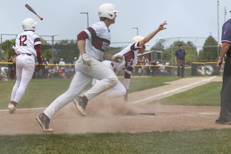 Plainfield North's Matt McCormick (19) takes to the field to celebrate with teammates after scoring the winning run over Oswego for the Class 4A Plainfield North Regional final baseball game. Saturday, May 31, 2025 in Plainfield.