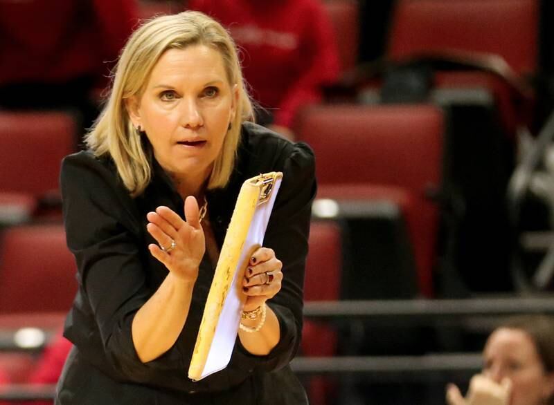 Mother McAuley head volleyball coach Jen DeJarld applauds her team during a timeout in the Class 4A semifinal game on Friday, Nov. 11, 2022 at Redbird Arena in Normal.