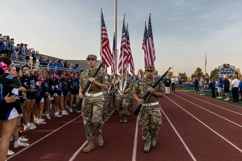 The Lincoln-Way JROTC carries the colors prior to a varsity football game against Metea Valley at Lincoln-Way East on Oct. 3, 2025.