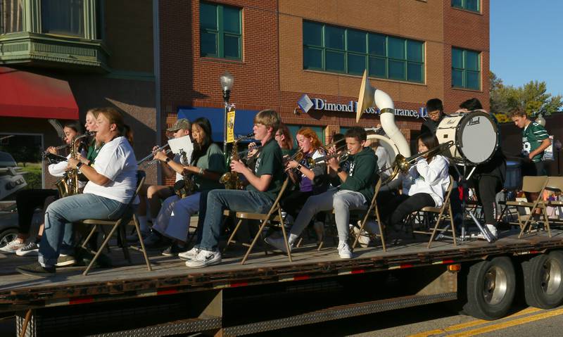 The St. Bede band rides on a float ride in the Homecoming parade on Friday, Sept. 30, 2022 downtown Peru.