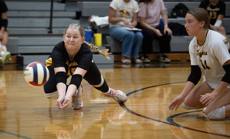 Herscher's Riley Wulff, left, makes a diving hit while Kiley Scanlon, right, backs her up in a match against Clifton Central on Monday, September 29, 2025.