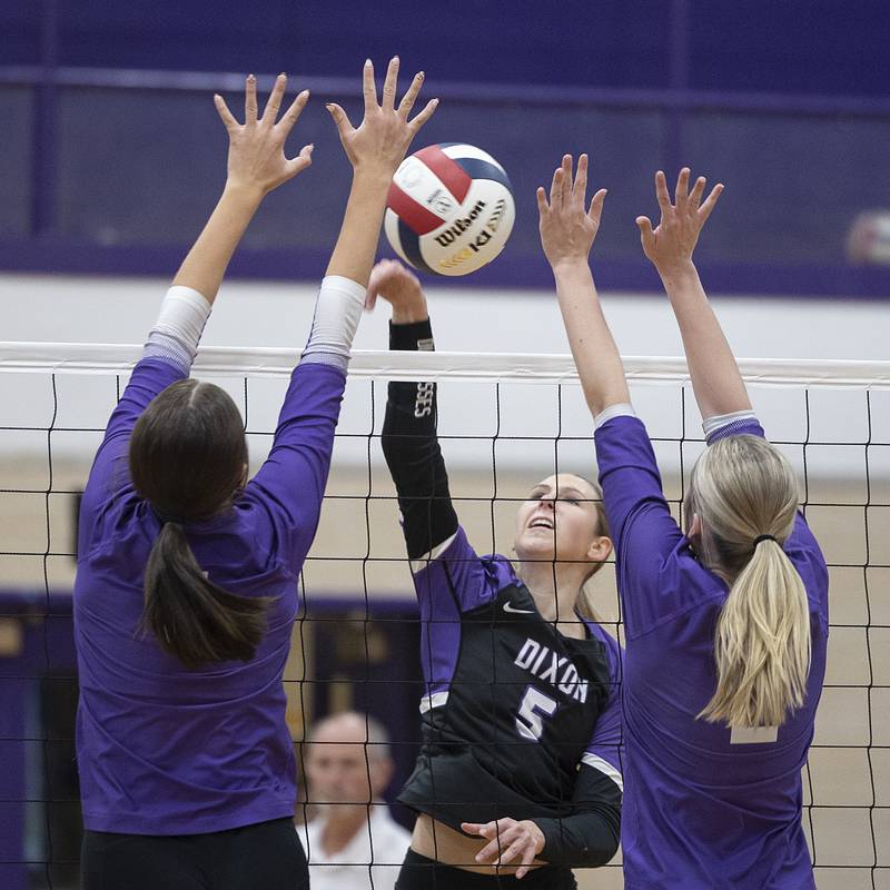 Dixon’s Morgan Hargrave splits the Rochelle defense Monday, Oct. 28, 2024, during regional play in Dixon.