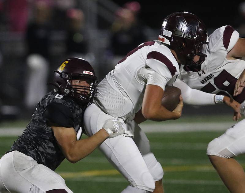 Richmond-Burton's Hunter Carley sacks Marengo's Sam Vandello during a Kishwaukee River Conference football game on Friday, Oct. 17, 2025, at Richmond-Burton High School in Richmond.