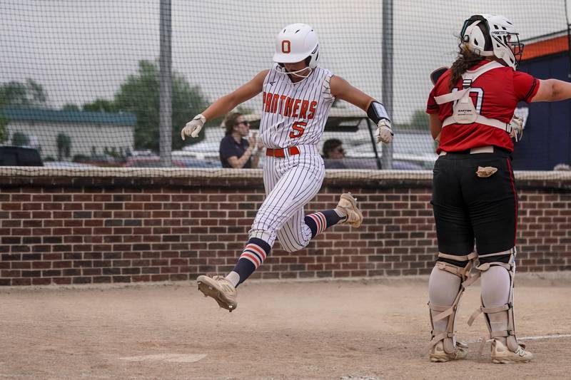 Oswego's Adalynn Fugitt (5) races to home to score a run against Yorkville during a softball game at Oswego High School on Thursday, May 15, 2025.