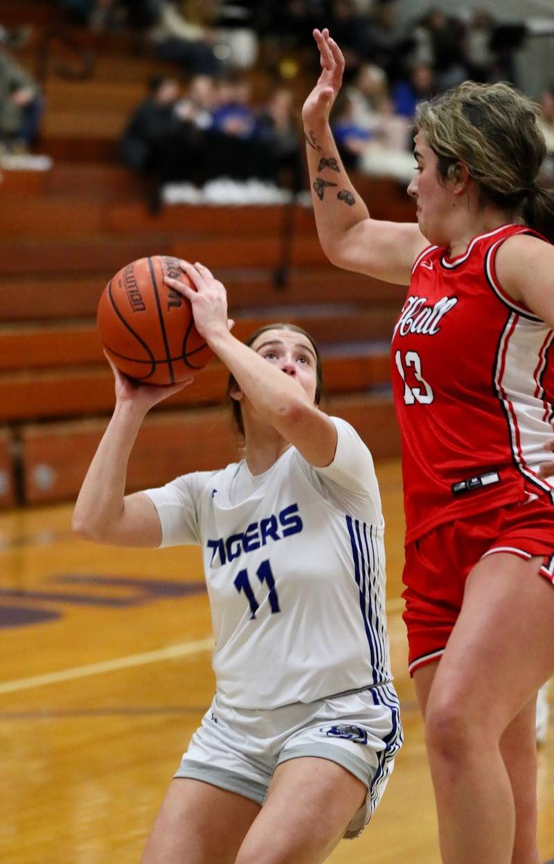 Princeton's Mikayla Hecht tries to shoots against Hall's McKenna Christiansen  Thursday night at Prouty Gym. The Tigresses moved into first place in the TRA East with a 57-38 win.