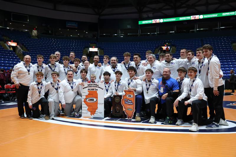 Marmion Academy poses with the IHSA Class 3A Dual Team State championship trophy following their victory over Montini on Saturday, Feb. 28, 2026.