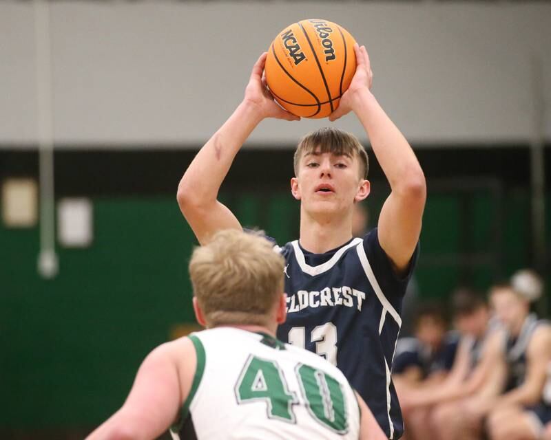 Fieldcrest's Layten Gerdes looks to pass the ball over Midland's Zach Allen on Wednesday, Feb. 19, 2025 at Midland High School.