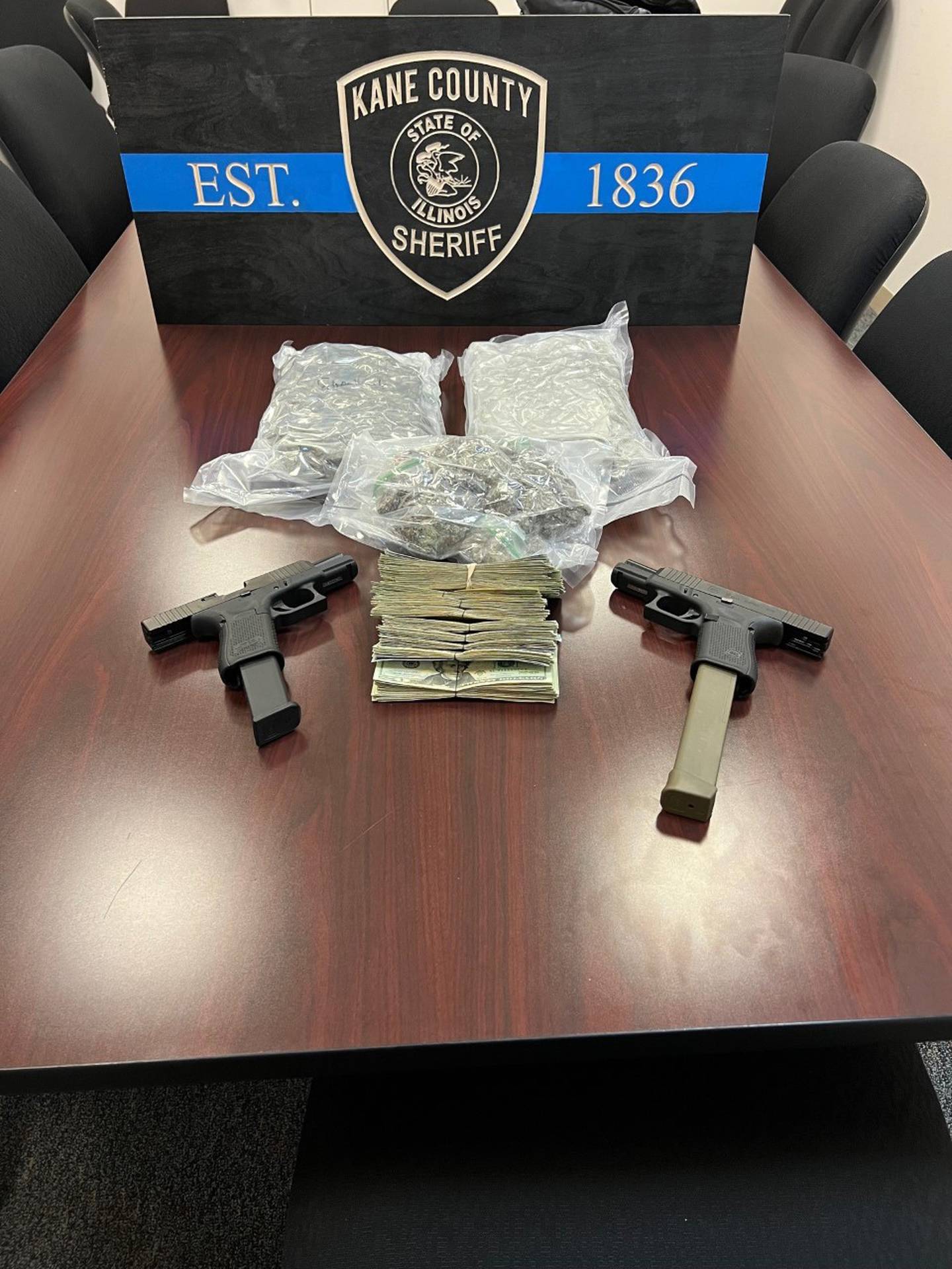 Kane County Sheriff’s Criminal Interdiction Team recovered two Glock 19s, 2.5 pounds of marijuana and alleged drug money of $13,522 in cash from the arrest of a Chicago man.