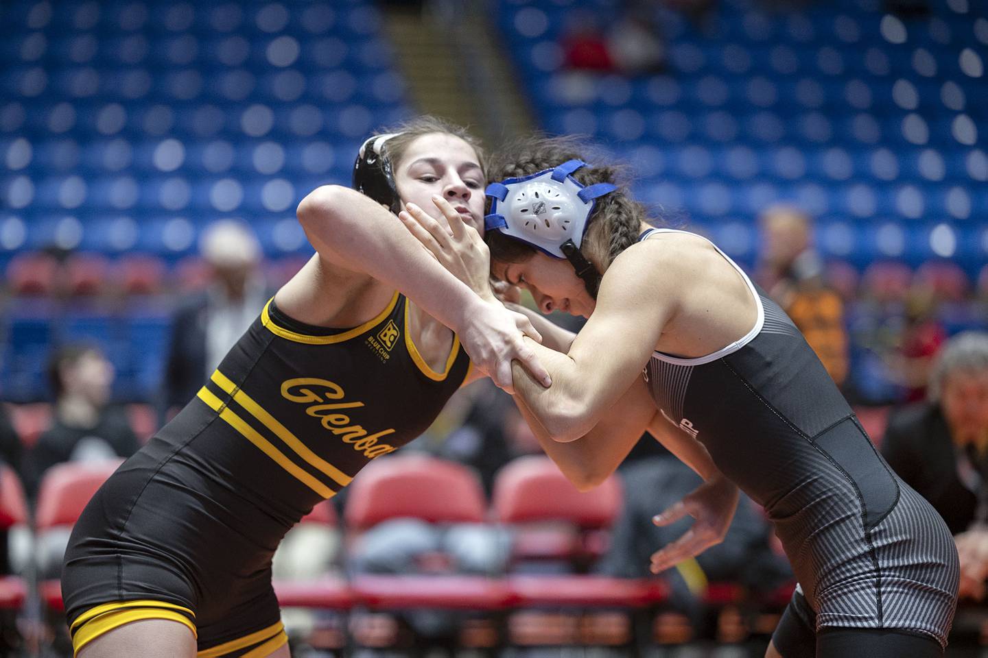 Gabriella Gomez of Glenbard North (left) and Eliana Paramo of Joliet Township (right) lock up during the IHSA Girls Wrestling State Finals on Saturday, Feb. 25, 2023, in Bloomington.