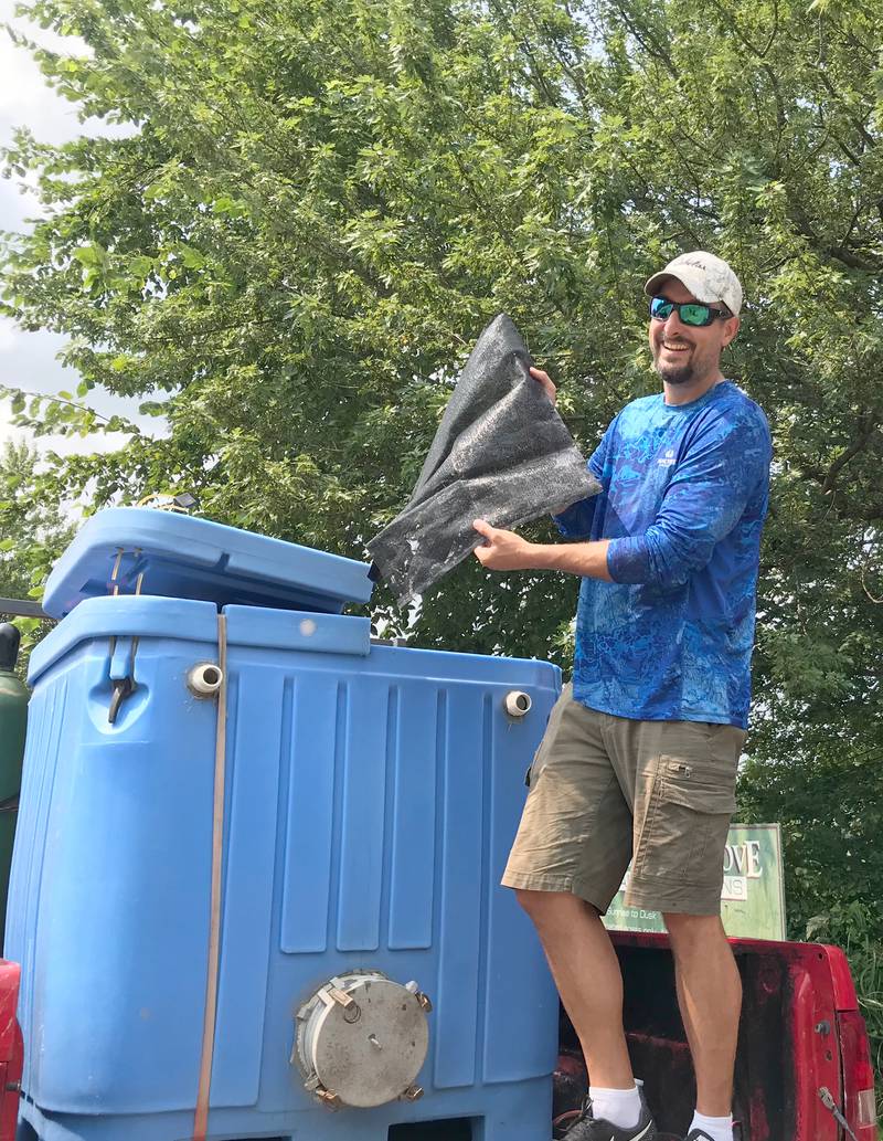 Jeremiah Haas, Exelon Quad Cities Station biologist, cared for the fish caught during the TBF Junior World Championship held in Rapids City last week. After weigh-ins, Haas put the fish into oxygenated tanks before releasing them back into the river. The Bass Federation ensures that the “local resources“ are cared for responsibly and returned to the water.