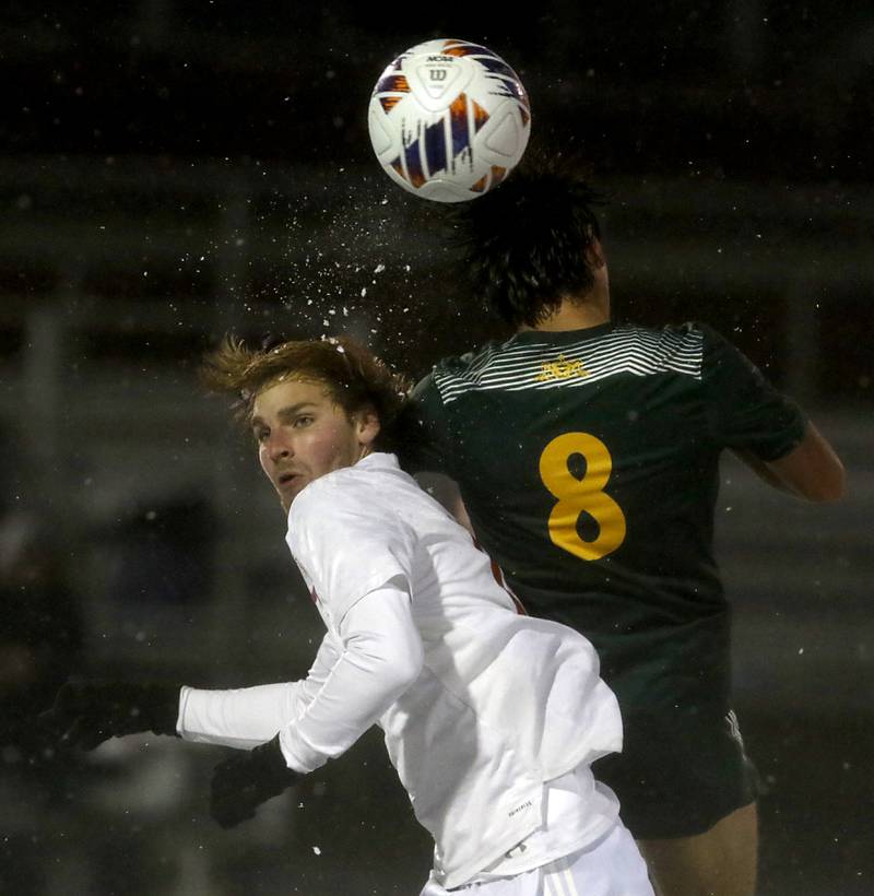 tc17\ heads the ball away from Crystal Lake South's Hayden Stone during the IHSA Class 2A Grayslake Central Supersectional soccer match on Tuesday, Oct. 31, 2023, at Grayslake Central High School.