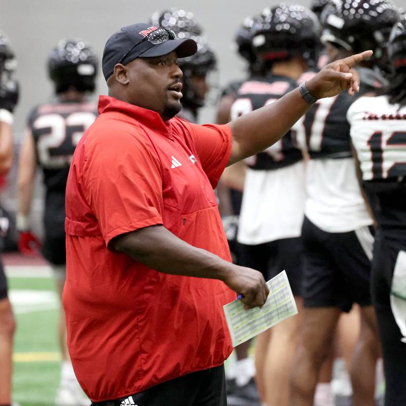 Northern Illinois University football head coach Thomas Hammock instructs his team Wednesday, July 31, 2024, during practice in the Chessick Practice Center at NIU.