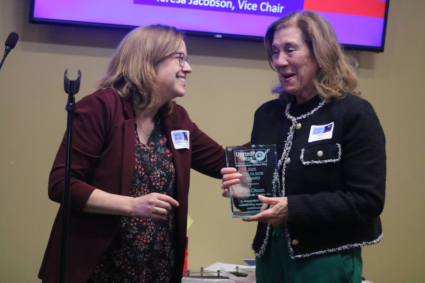 CASA DeKalb County Executive Director Jill Olson (right) receives the LEO Olson 2025 award Thursday, Feb. 13, 2025, at  Kishwaukee United Way's annual meeting held at Faranda's Banquet in DeKalb.