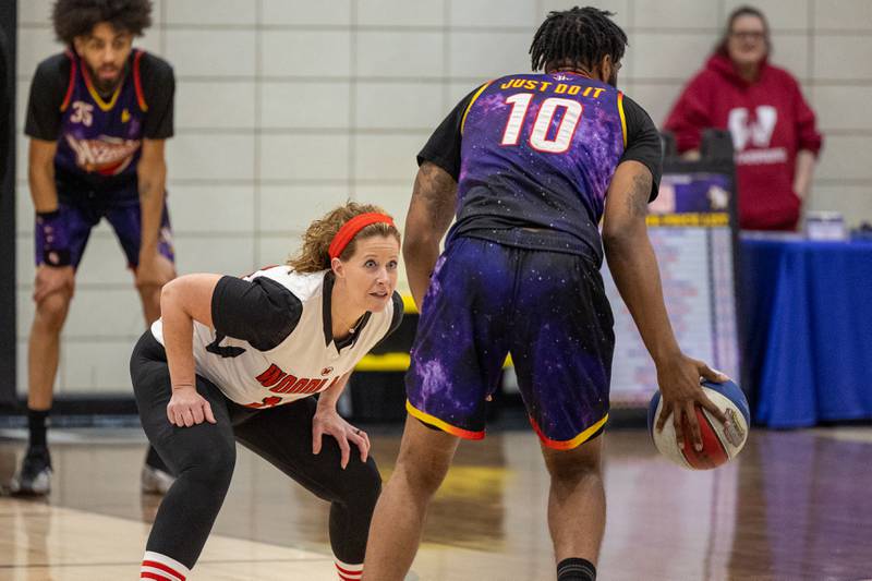 Mrs. Alsvig (2) of Woodland High School guards Deven “Just Do It” Dorsett (10) of the Harlem Wizards on Wednesday, April 16, 2025 at Woodland High School in Streator.