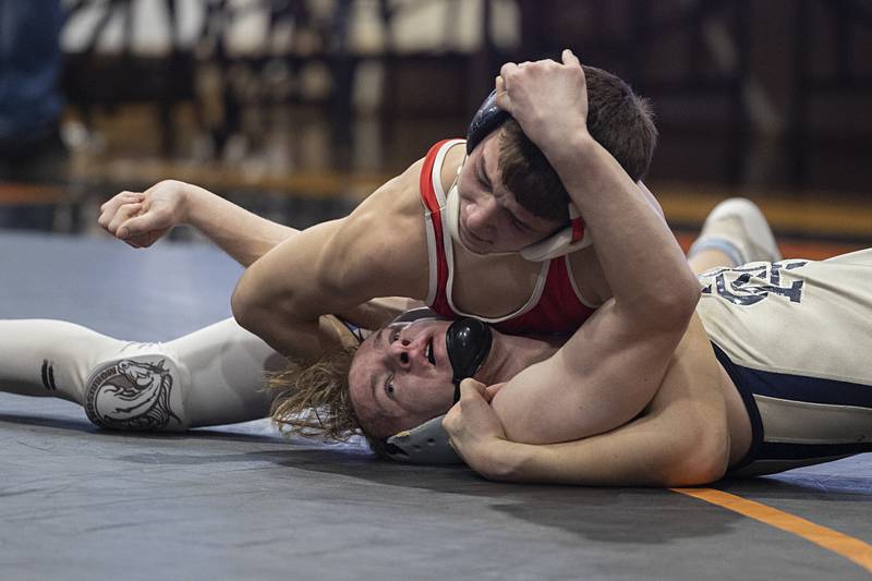 Newman’s Zhyler Hansen is pinned by Morrison’s Eli Modglin in the 126 pound first place match Saturday, Feb. 14, 2026, during the Class 1A wrestling sectionals in Byron.