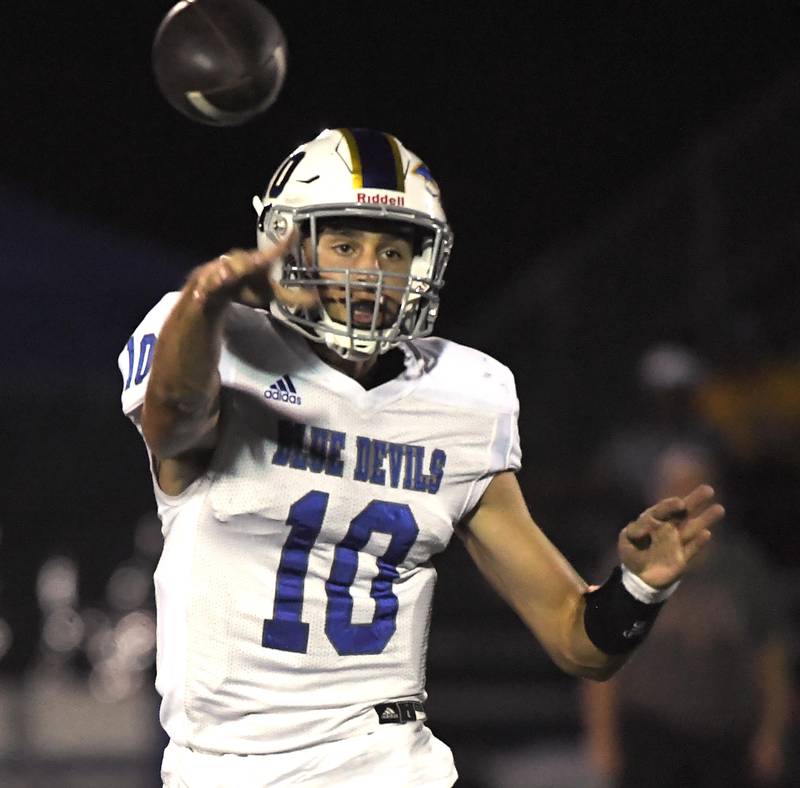 Warren’s Jack Wolf passes against Lake Zurich in a football game in Lake Zurich on Friday, September 22, 2023.
