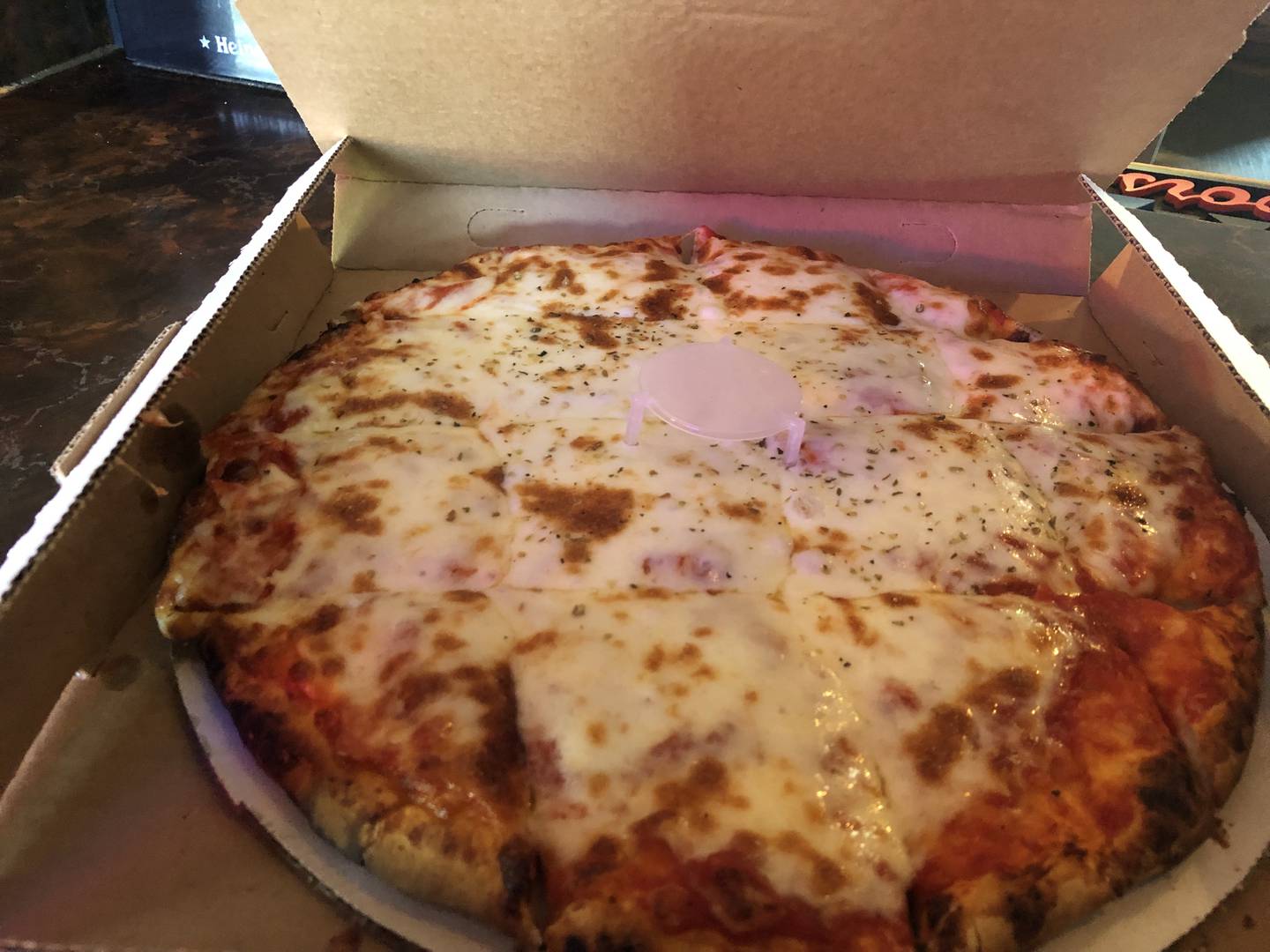 A cheese pizza with a homemade crust from Hoops Bar and Grill, Hebron.