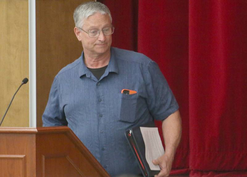 Dave Noble Economic and Community Development  director with the City of Ottawa, steps away from the podium after speaking to the Illinois Health Facilities and Services Review Board during a public hearing regarding OSF St. Elizabeth Hospital's plans to reduce services on Tuesday, June 10, at Central Intermediate School in Ottawa.