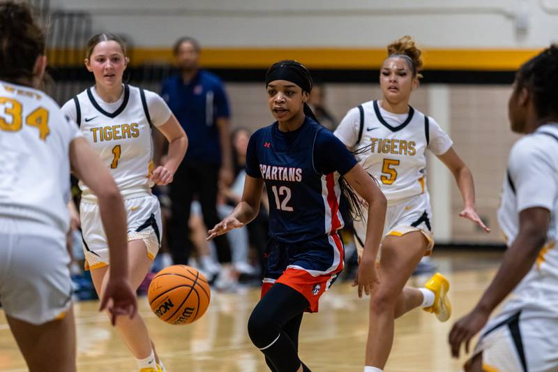 Romeoville's Aaliyah Adams breaks away from the defense during a varsity girls basketball game against Joliet West at Joliet West on Dec. 11, 2025.