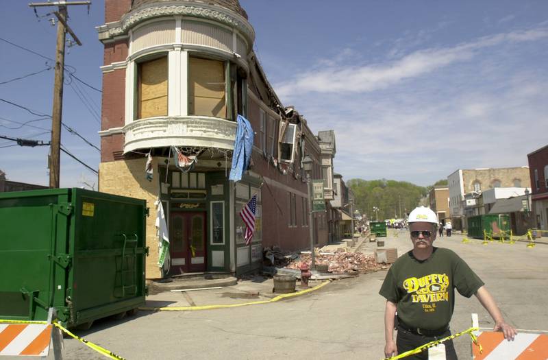 Lisle Elsbury former owner of Duffy's Tavern now Lodi Taphouse poses outside the famous tavern the day after the tornado on Wednesday, April 21, 2004.