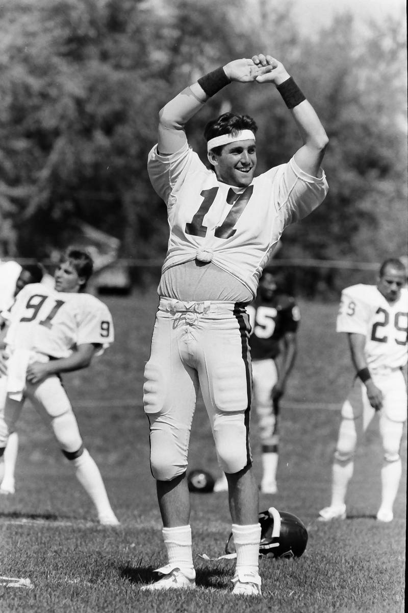Chicago Bears quarterback Ken Cruz stretches during training camp on Wednesday, June 12, 1985 in Platteville Wis.