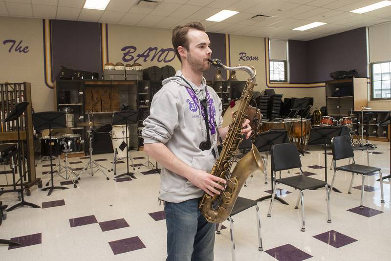 Dixon High School band director Riley Carter cut his chops on the saxophone.