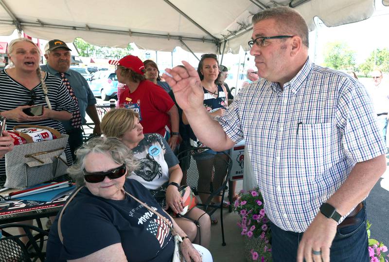 Darren Bailey, a Republican candidate for Illinois governor, talks to supporters Friday, June 17, 2022, during his campaign stop at Tom and Jerry's in Sycamore. Bailey is currently on a bus tour across the state that will cover 102 countys in 14 days.