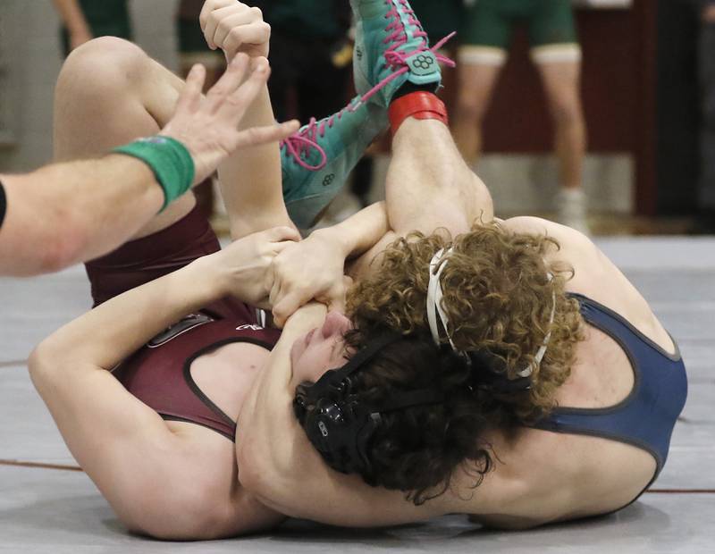 Cary-Grove’s Noah Pechotta pins Prairie Ridge’s Shaun Brewis in a 165-pound match of the IHSA 2A Antioch Wrestling Regional on Saturday, Feb. 8, 2025, at Antioch High School.
