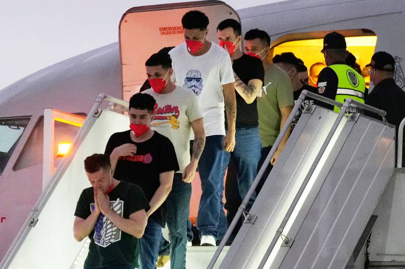 FILE - Migrants deported months before by the United States to El Salvador under the Trump administration's immigration crackdown arrive at Simon Bolívar International Airport in Maiquetia, Venezuela, July 18, 2025. (AP Photo/Ariana Cubillos, File)