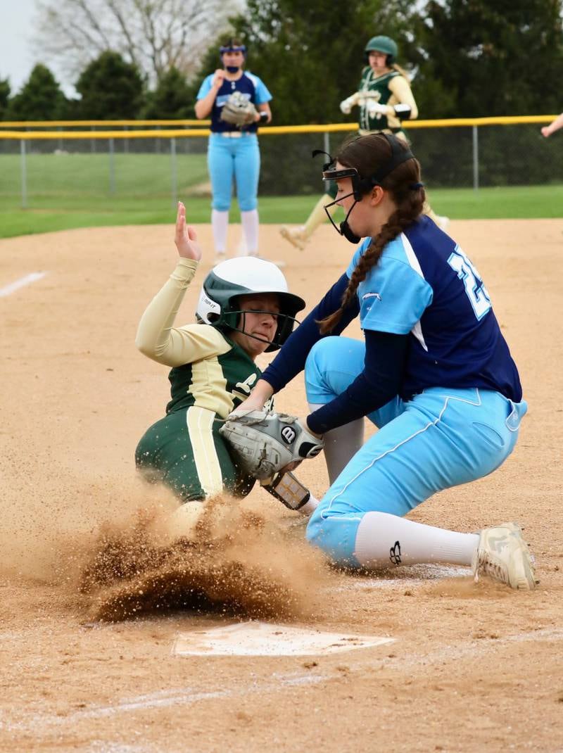 Bureau Valley pitcher Tyra Sayler puts the tag on St. Bede's Bella Pinter at the plate on a wild pitch in the first inning of Monday's game at Manlius. The visiting Bruins won 11-4.