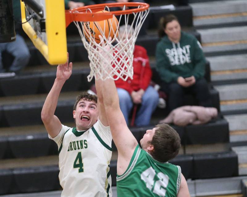 St. Bede's Gino Ferrari has his shot blocked by Dwight's Jackson Launius during the Tri-County Conference Tournament on Tuesday, Jan. 27, 2026 at Putnam County High School.