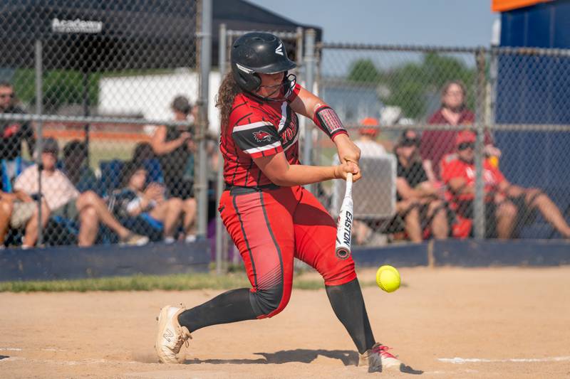 Yorkville's Kayla Kersting (10) singles driving in a run against Wheaton Warrenville South during the Class 4A Oswego softball sectional final game between Yorkville and Wheaton Warrenville South at Oswego High School on Friday, June 2, 2023.