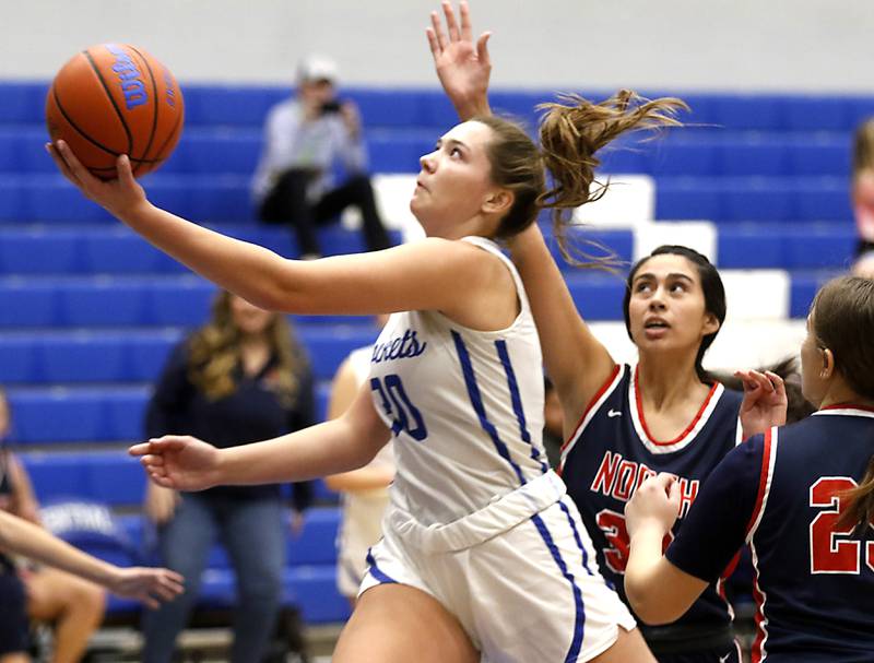 Burlington Central's Emma Payton drives to the basket against Belvidere North on Monday, Nov. 13, 2023, during pool play girls basketball game in the Burlington Central Mark Einwich Tournament.