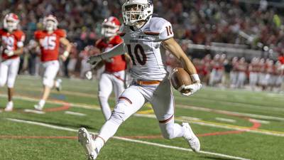 Photos: Oswego, Naperville Central football meet in season opener