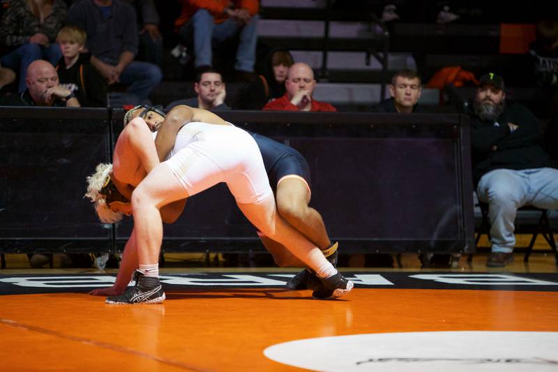 DeKalb's David Stewart competes in the 195 lb class with Sycamore's Gable Carrick on Friday, Dec. 9,2022 in DeKalb.