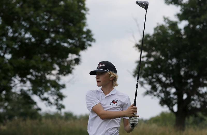 Samuel Sterzik watches his tee shot on the fourth hole during the final round of McHenry County Junior Amateur Golf Tournament  on Tuesday, July 18, 2025, at Foxford Hills Golf Club in Cary.